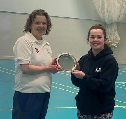 Sam Rossiter receives the trophy from Lauren Arthur