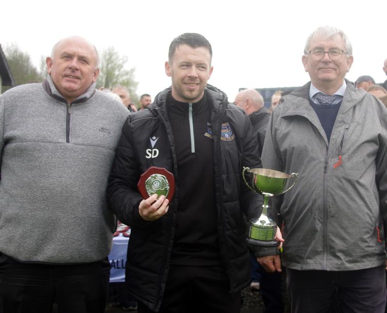 Winning Senior Cup manager Scott Davies received the Lilian Holman Memorial Cup