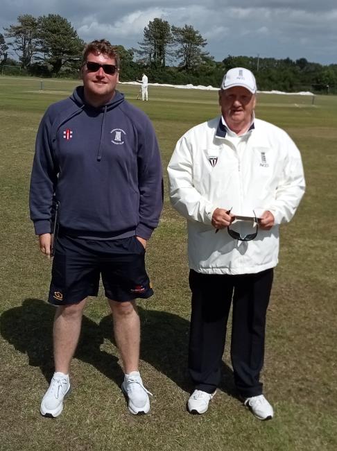 Scorer Simon Williams and umpire Chris Stapleton