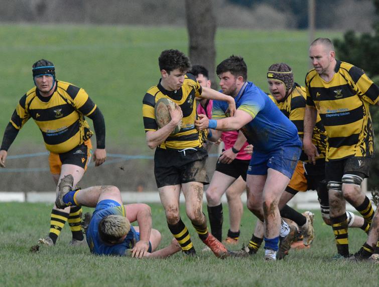 Llangwm scrum half Josh Richards spots a gap