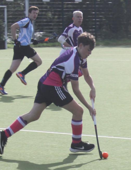 George Twigg playing hockey