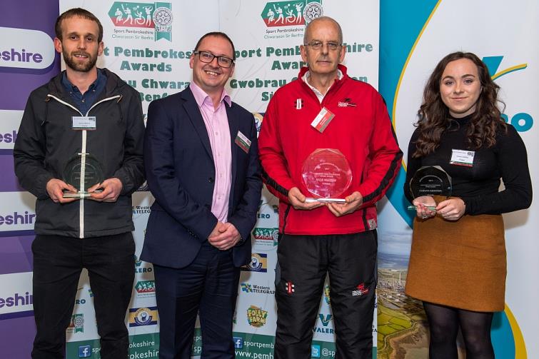 Contribution to School Sport -  Winner Rick Walton is presented with his award by Carwyn Young from Sport Wales. The finalists are Cariann Griffiths and Jonny Griffiths.