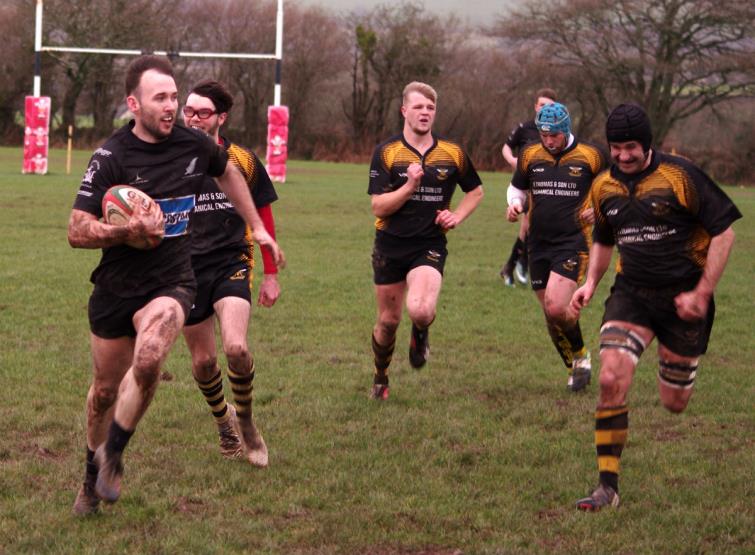 Patrick Bellerby canters over for the first try for Neyland