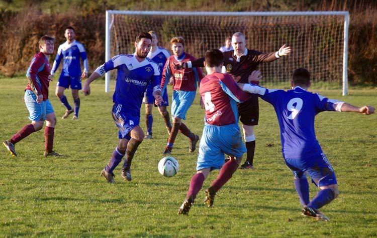 Peter Thomas pushes forward for Merlins Bridge against St Clears on the Racecourse