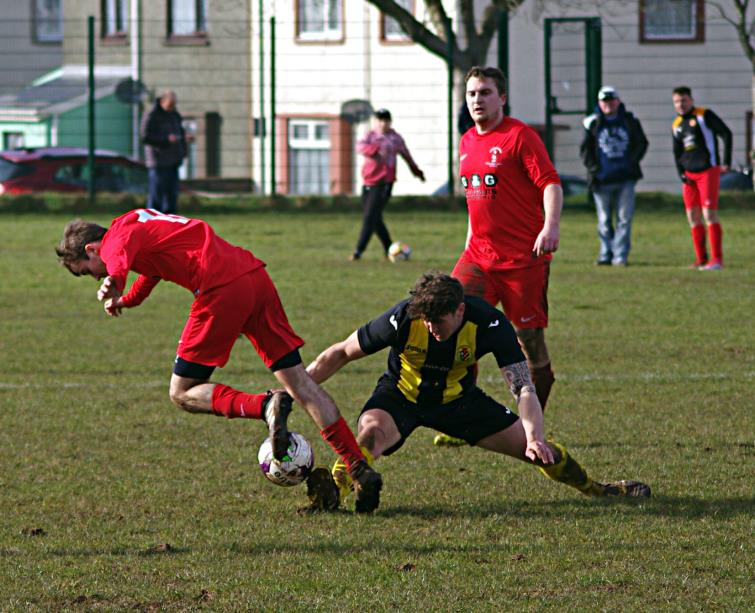 Mark Jones puts in a timely tackle for Herbandston against Pennar Robins