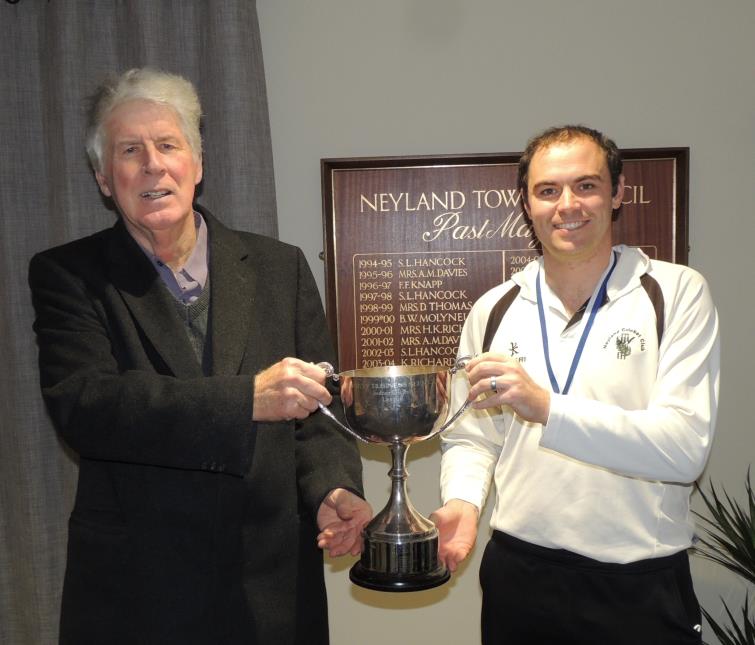 Phil Tallett presents the trophy to Sean Hannon
