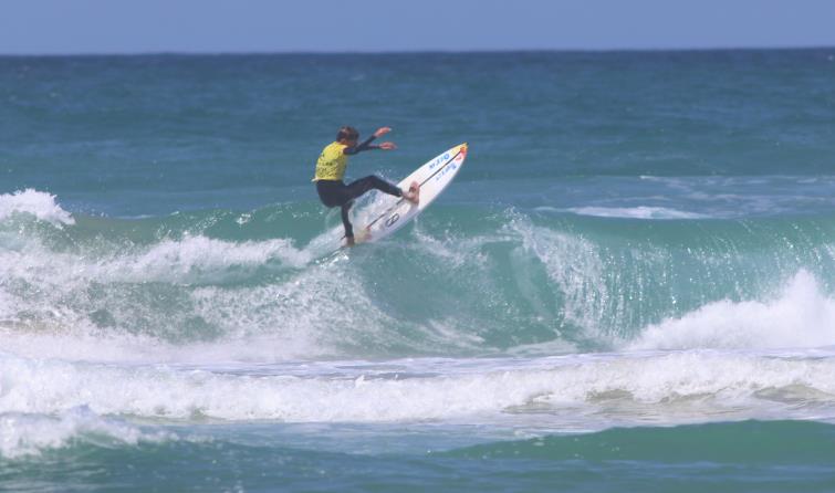 Phil on top of a wave