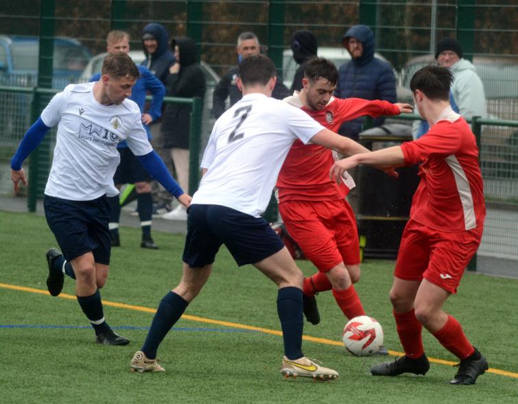 Milford United look for a way forward against Merlins Bridge. Picture Gordon Thomas