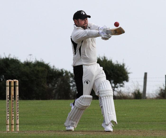 Ross Hardy smashes a boundary