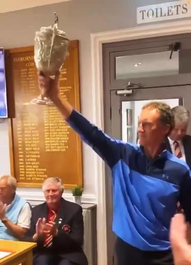 Raises the silverware aloft