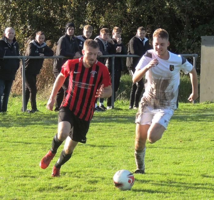 Rhys Dalling skins a Clydach defender