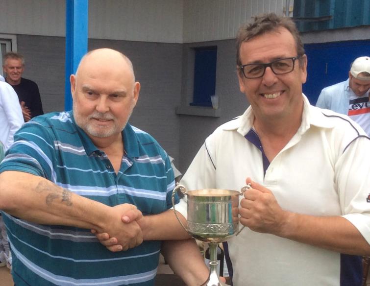 Richard Morris presents the trophy to Rob Nicholas
