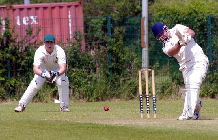 Narberths Ritchie Adam smashes a boundary on his way to 104 not out at Neyland
