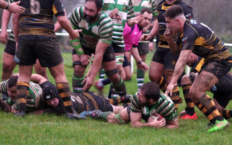 Whitland flanker Ryan Morgan pounces for a try
