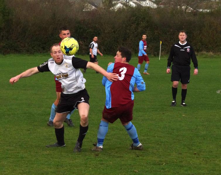 Adam Hawkins in action for Merlins Bridge who lost 1-2 at home against North End