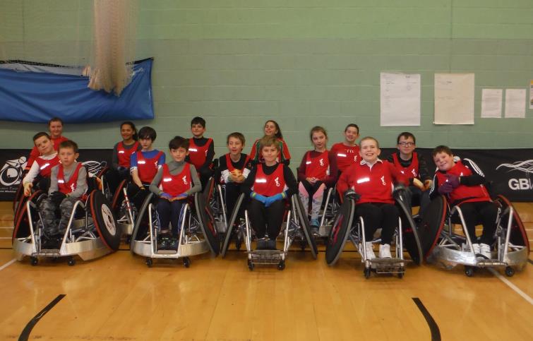Scarlets team proudly wearing their new playing vests.
