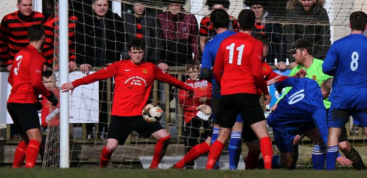 Shaun Whitfield clears for Carew. Picture by Brian McKehon