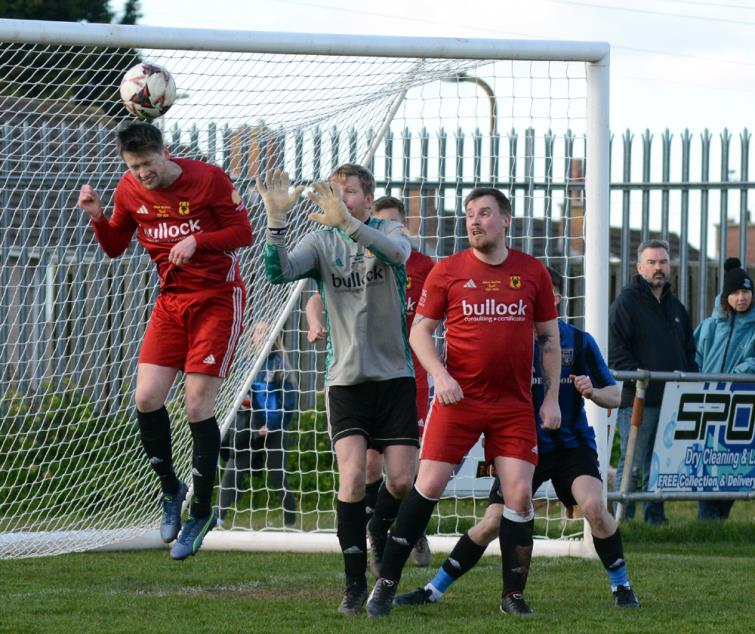 Shaun Whitfield clears the danger for Carew against Hakin United a the Obs. Picture Gordon Thomas