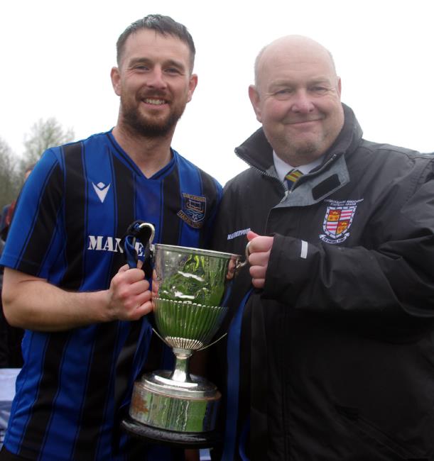 Winning Hakin skipper Ryan Wilson and League Secretary Ian Baker with the silverware