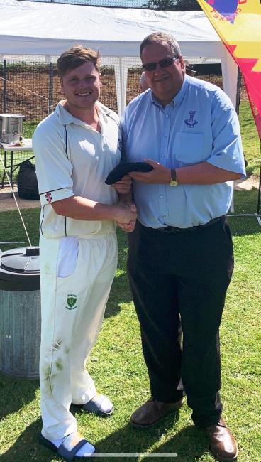 Toby Hayman is awarded his county cap by Richard Merriman
