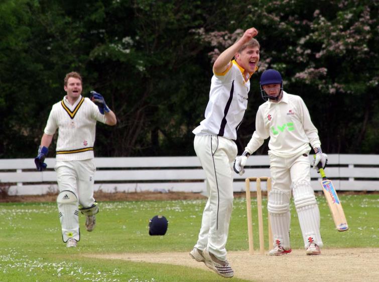 Matthew Kiff takes the early wicket of Kilgetty opener Toby Poole