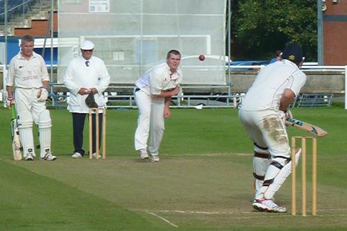 Tom Davies bowls for Carew