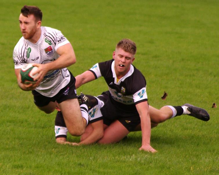Determined tackling by The Quins