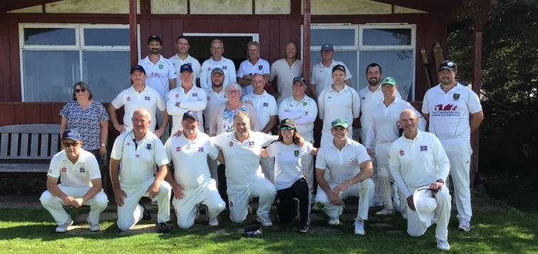 Teams pose before memorial game