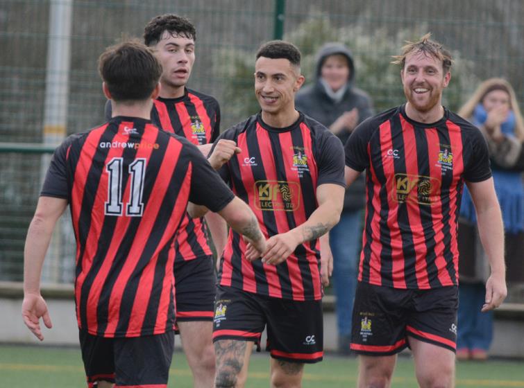 Tenby players celebate scoring against Merlins Bridge. Picture Gordon Thomas