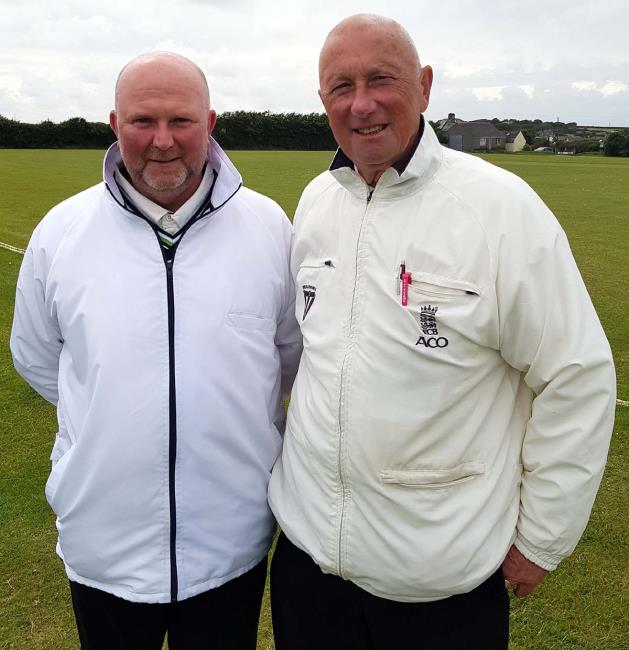Umpires Allan Hansen and Ian  Milsom