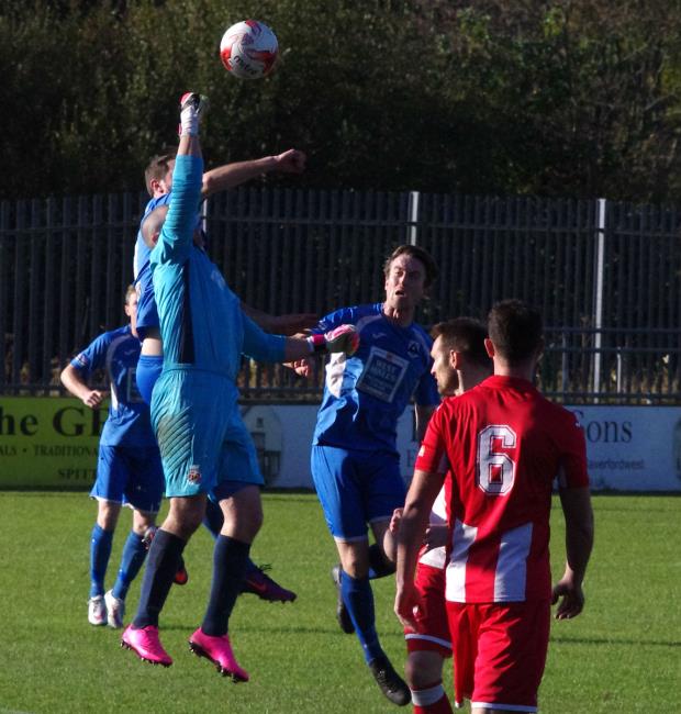Undy keeper James Smallcombe punches clear