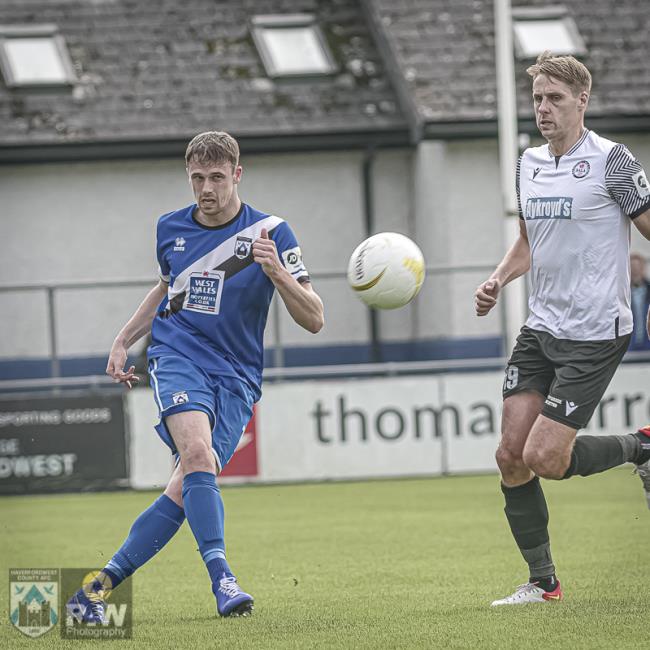 Jack Wilson clears under pressure from Dave Edwards