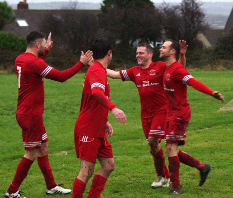Dragons team mates celebrate
