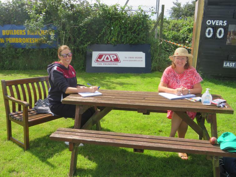 Scorers Chrissie Toy and Diane Morris
